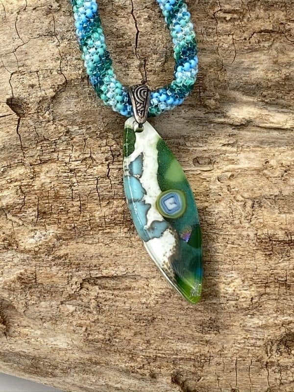 pointed oval teal, green and ivory pendant on a 19" custom hand beaded chain with toggle clasp