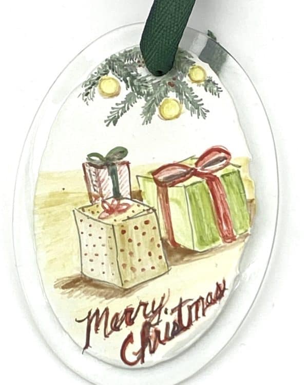 packages with Merry Christmas on an oval ornament