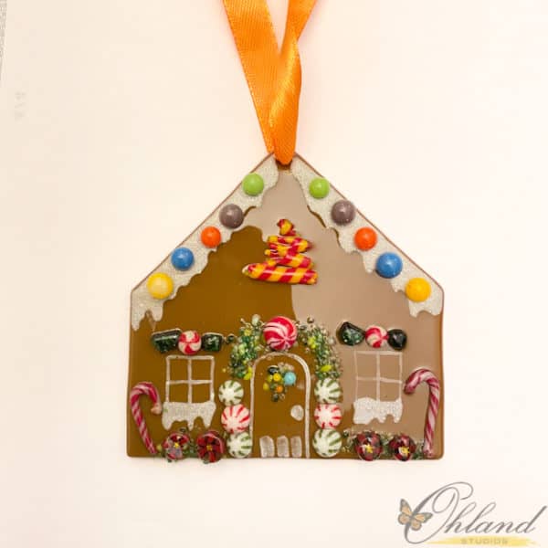 gingerbread ornament that is 3x3, mini mints, candy dots and candy canes adorn this little glass ornament