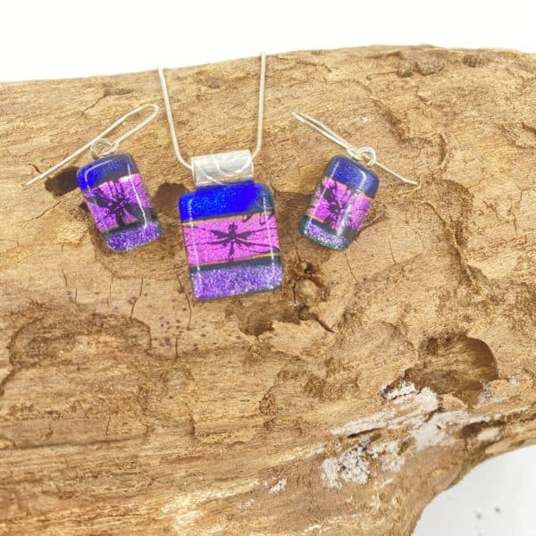 Hot Pink, purple and blue striped very shiny glass pendant and earring set. All are square/rectangle and the hot pink center stripe has dragonfly image etched in black
